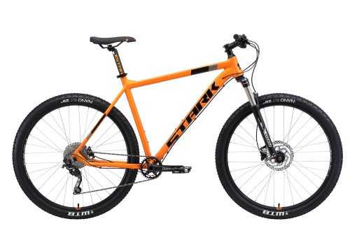 Горный велосипед Stark&#039;19 Krafter 29.7 HD 22 оранжевый/чёрный •   диаметр колёс - 29.7 дюйма;
•   материал рамы - алюминиевый сплав;
•   количество скоростей - 10;
•   пол - унисекс;
•   амортизация: Hard tail, ход вилки - 100 мм;
•   задний тормоз - дисковый гидравлический;
•   задний переключатель - RD-M610-10.
